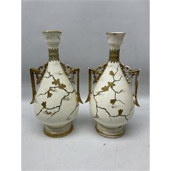 Pair of Franz Mehlem Bonn vases, the twin handled bodies painted with birds amongst blossom branches with a sun, detailed with gilt, H30cm