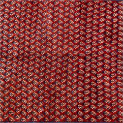 West Persian Saraband (Boteh-Mir) runner madder-red field densely decorated with repeating boteh motifs, arranged in diagonal rows enclosed by a geometric border of stylized motifs, between multiple guard stripes, cotton fringe ends  