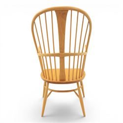 Ercol - Windsor 'Chairmakers' light ash armchair, with traditional spindle backrest, above a dished seat, with cylindrical supports united by a carolean stretcher