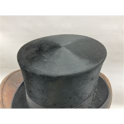Early 20th century black silk top hat by Woodrow of Manchester and London, with manufacturer's stamp to the silk lined interior, housed in fitted tan leather hat box with removable internal compartments with straps, brass escutcheon and engraved plaque, hat internal measurements approx 20cm x 15cm