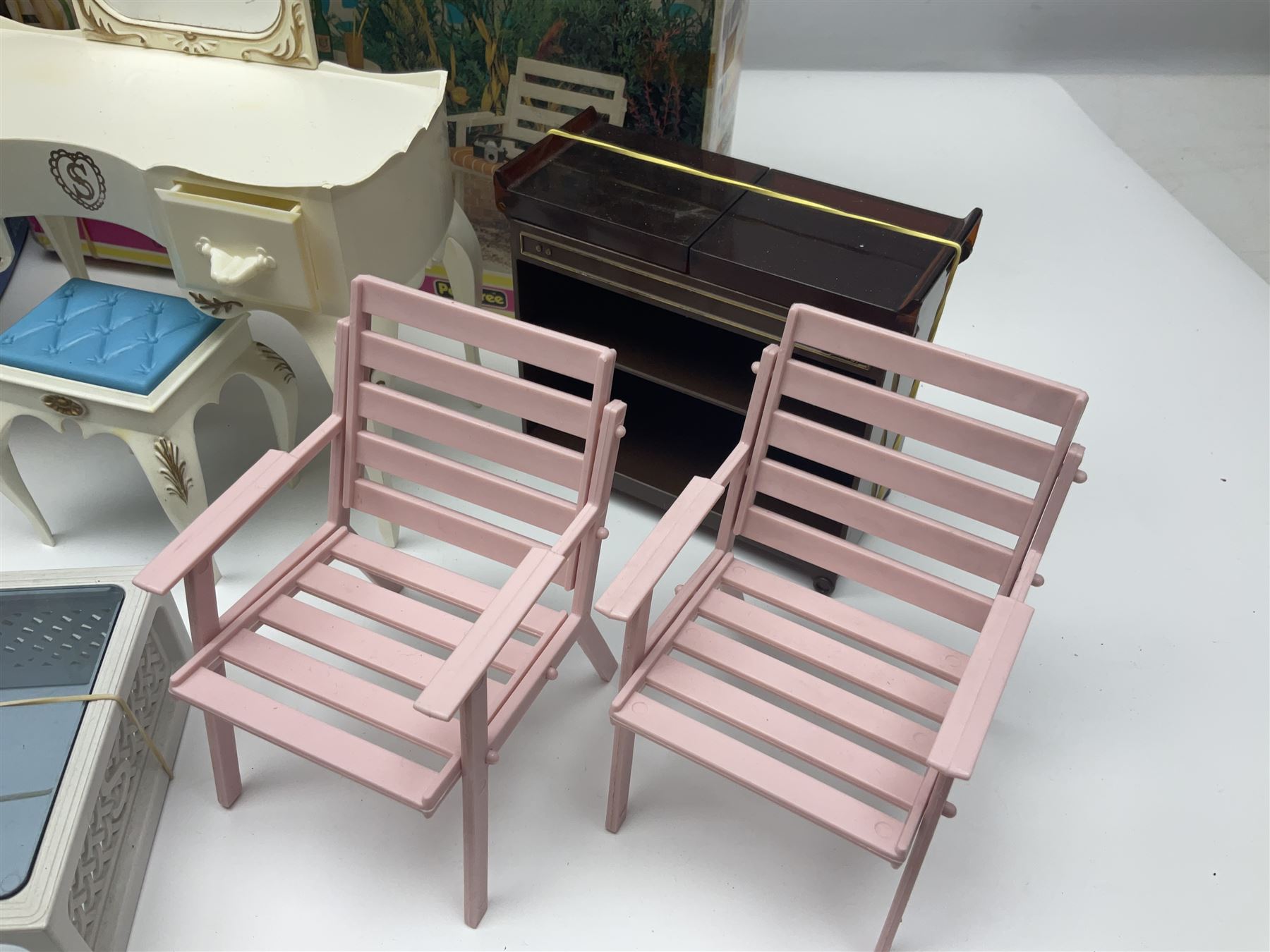 Sindy - furniture and accessories comprising dining suite with separate dresser; two beds; Garden Set; Music Centre; all  boxed; three-piece bedroom suite; settee; Hostess Trolley; two coffee tables; and four-piece bathroom suite including shower cubicle