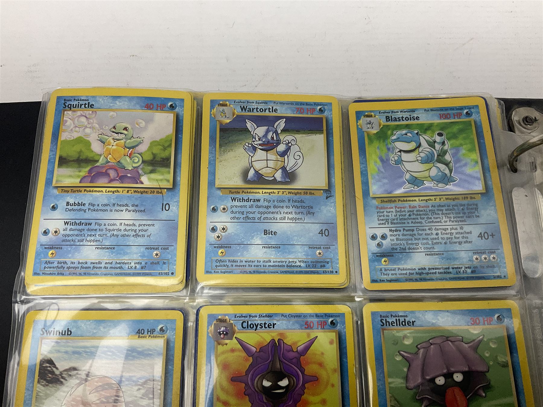 Collection of Pokemon trading cards, mostly 1999 Wizards Pokemon cards to include holo Charizard 4/102, first edition holo Machamp 8/102, further holographic cards; Dark Flareon 35/82 and Dark Vaporeon 45/82, cards from themed sets and 4th edition prints; 1998 Electronic Pokédex with cardboard boxes for themed decks Blackout, Overgrowth and Power Reserve Jungle, along with a large quantity of energy and trainer cards 