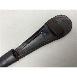 Third Pattern Commando Knife or Dagger with 17.5cm flattened diamond section blade and regulation black painted ribbed copper hilt with brass pommel nut; stamped William Rodgers Sheffield England to the cross-piece; in black painted brass mounted leather scabbard L34.5cm overall