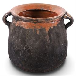 Spanish twin handled cooking pot, blackened to the outside, together with two bowls with slipware glaze, pot H22cm 