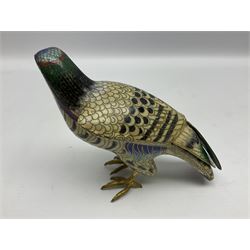 Pair of early 20th century Chinese cloisonné falcons, the 'plumage' picked out in hues of blue, green and red, each with gilt metal beaks and talons, and applied wing tips, with naturalistically modelled wooden stands of differing heights carved as tree stumps, tallest falcon H11.5cm L14cm
Provenance: Purchased by the vendors family in 1986 in Jeddah, Saudi Arabia
