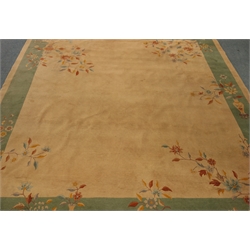  Large Indian rug, beige ground with green border, 365cm x 402cm  
