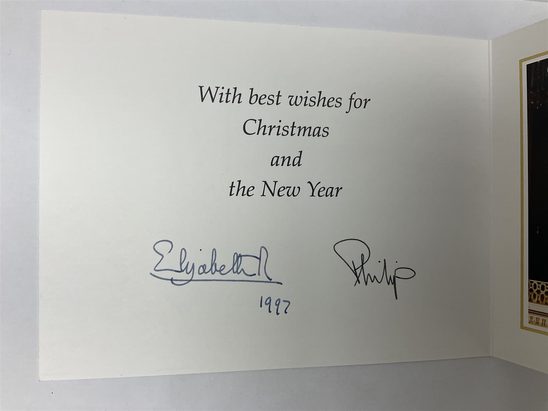 HM Queen Elizabeth II and HRH the Duke of Edinburgh - signed 1997 Christmas card with two gilt cyphers to front and colour photographic portrait inside,  signed Elizabeth R and Philip with manuscript date 1997 below