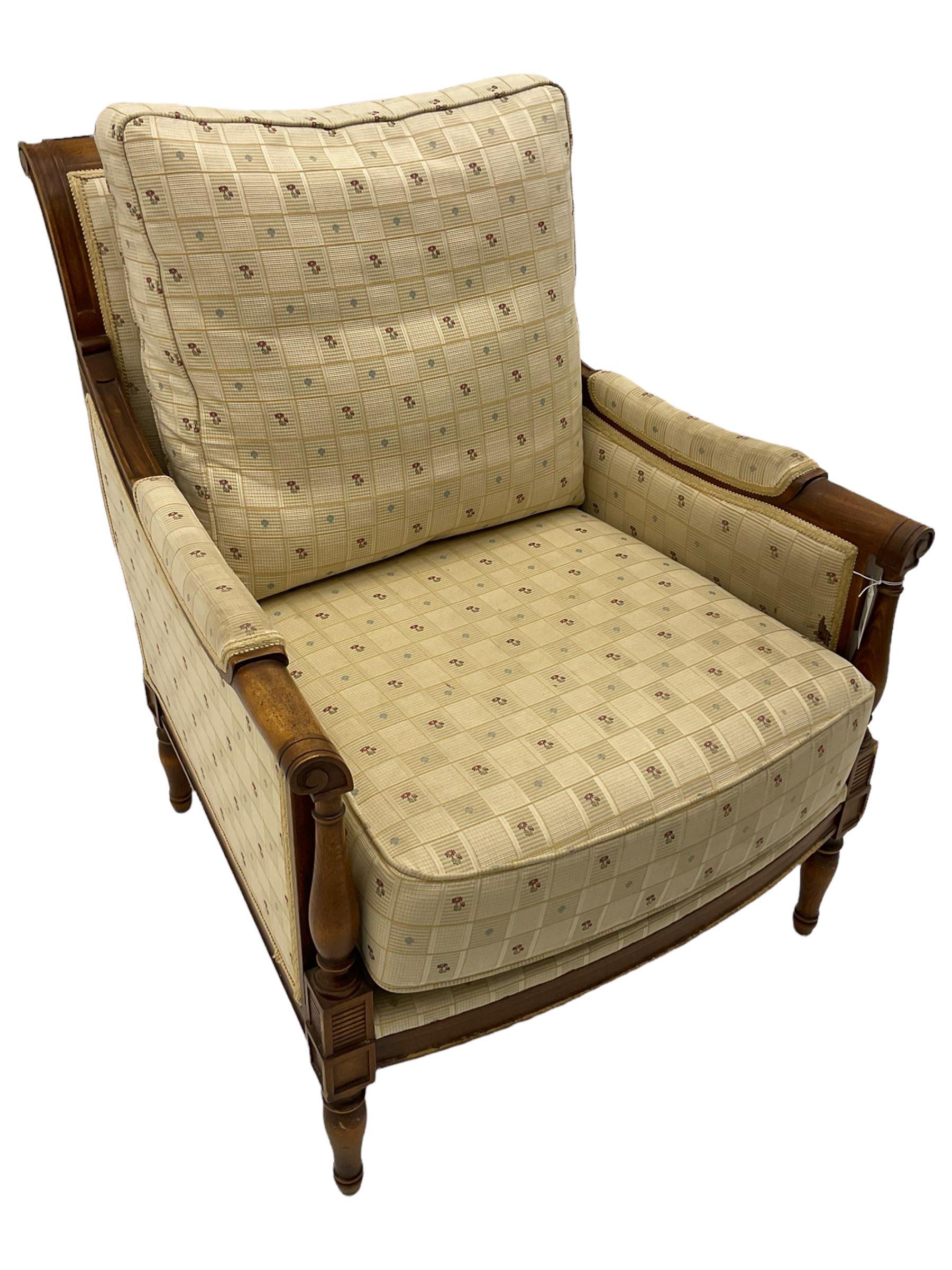 Wesley Barrell - beech framed armchair, upholstered in floral patterned fabric, on turned supports