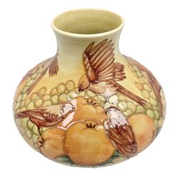 20th Century Moorcroft Finches pattern vase of squat form, upon a ochre ground, designed by Sally Tuffin, with impressed mark beneath, H21cm 
