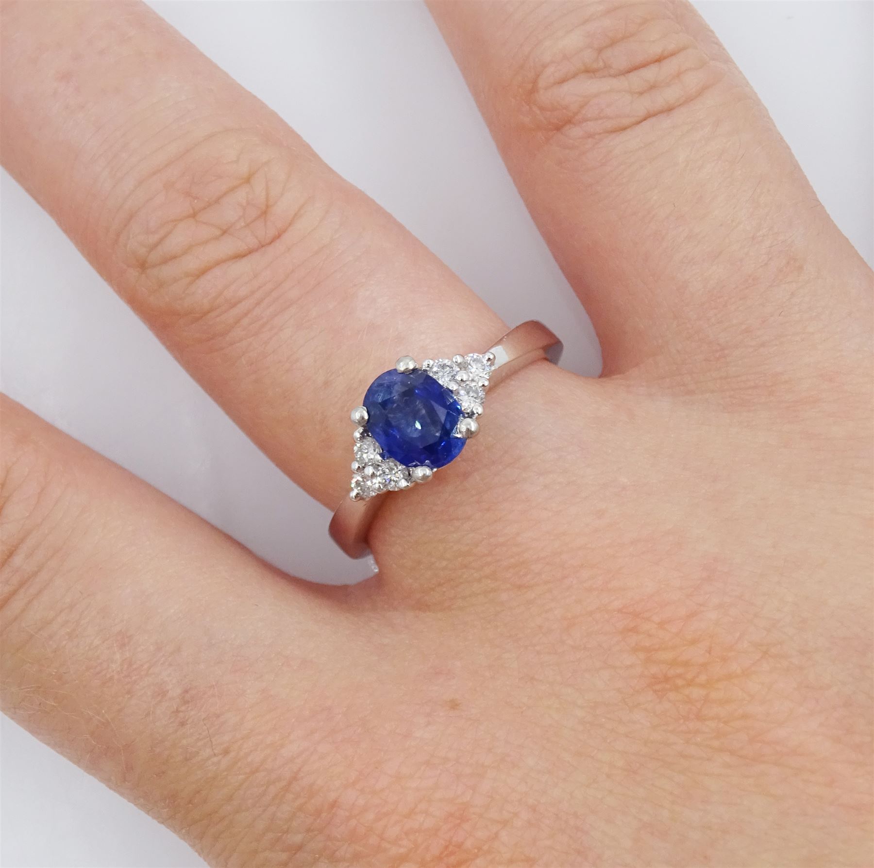 Platinum oval cut sapphire and six stone round brilliant cut diamond ring, hallmarked, sapphire approx 0.90 carat