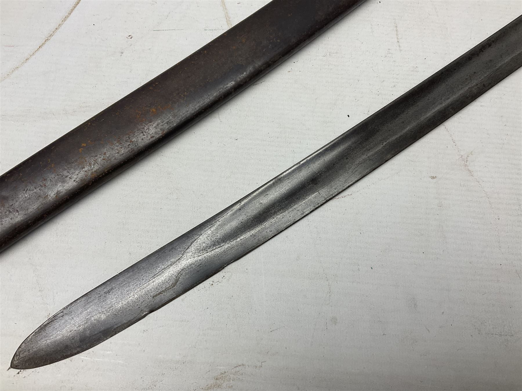 Italian M1833 Sabre with slightly curving 79cm fullered steel blade, the plain steel hilt with 'D' shaped knuckle bow, langets and wire-bound leather grip; in steel scabbard with single hanging ring L101cm overall