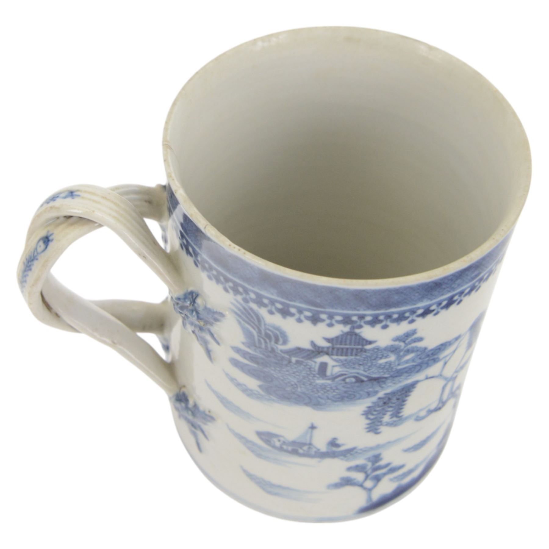 Large 18th century Chinese export blue and white tankard, of cylindrical form with foliate mounted strap handle, the body painted with a riverside landscape with pagodas, willows and pine trees, beneath a cell and spear head band to rim, H14cm D10.5cm