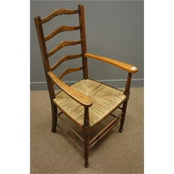  Early 20th century oak ladder back armchair, rush seat, turned supports  