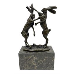 Bronze figure group, modelled as two male hares boxing, raised upon marble plinth base, with foundry mark, H24cm