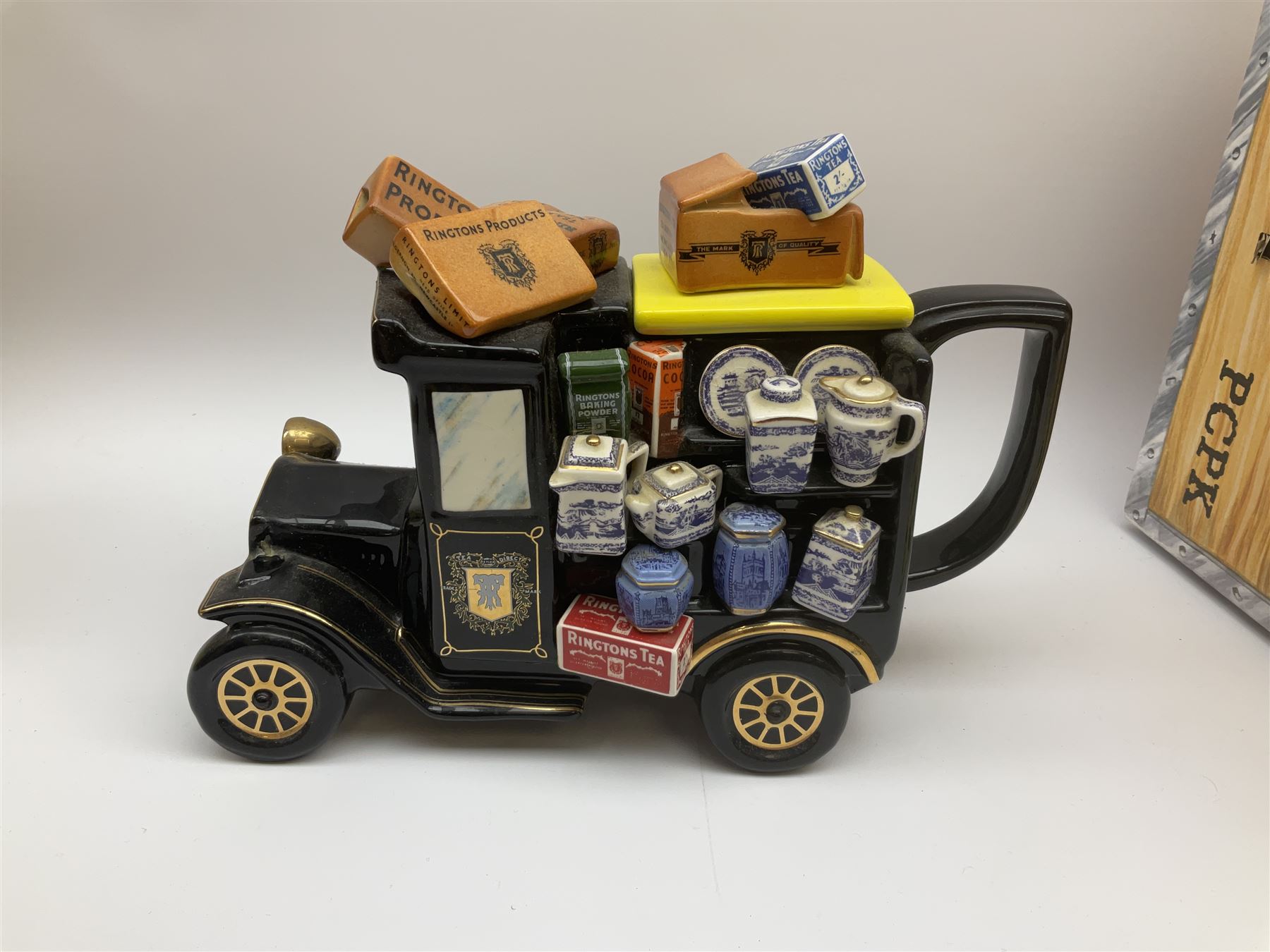 Ringtons novelty teapots, comprising the Ringtons Delivery Van teapot, and the Tea Merchant teapot, both with boxes and certificates of ownership.
