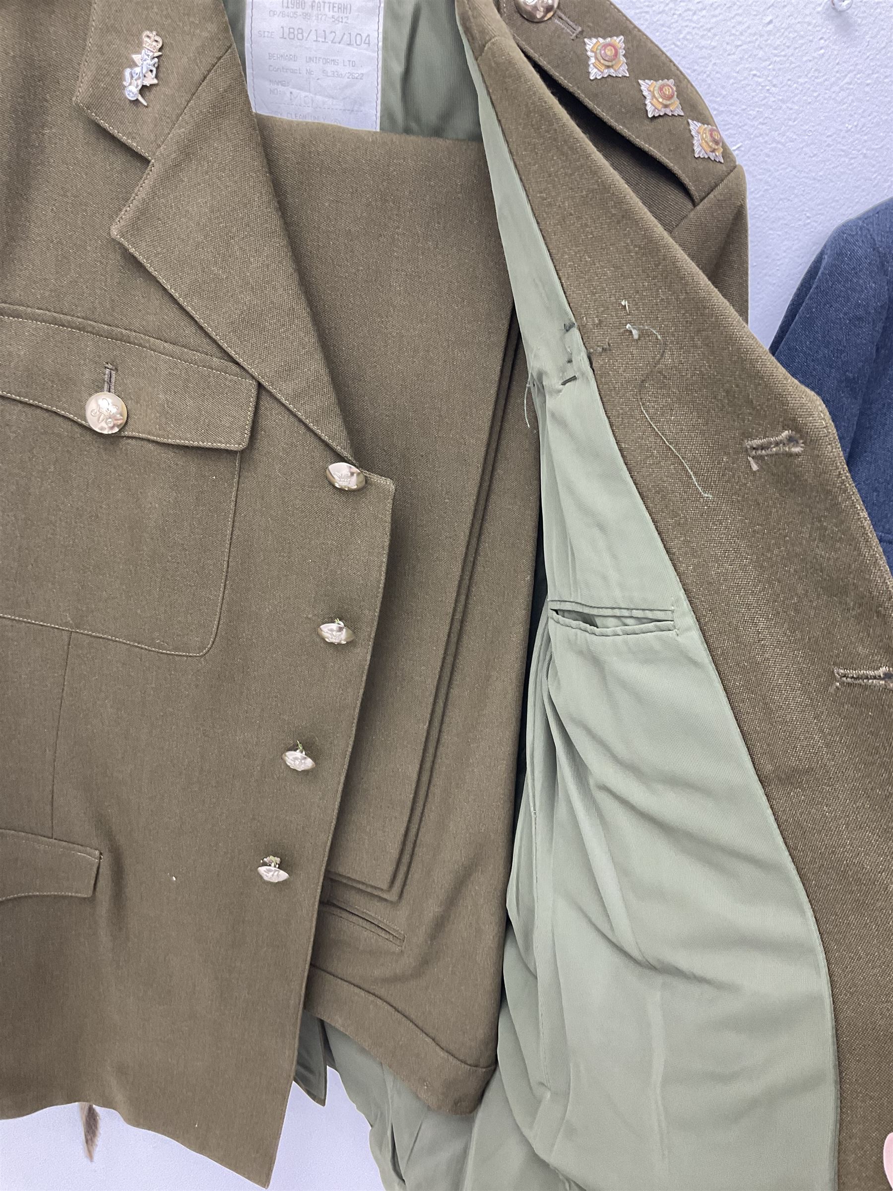 RAF Flight Lieutenant's uniform with peaked cap and WW2 ribbon bar; WW2 gas mask in blue canvas bag dated 1942; flying helmet date 1984; and British Army Major's uniform with Staybrite buttons and peaked cap