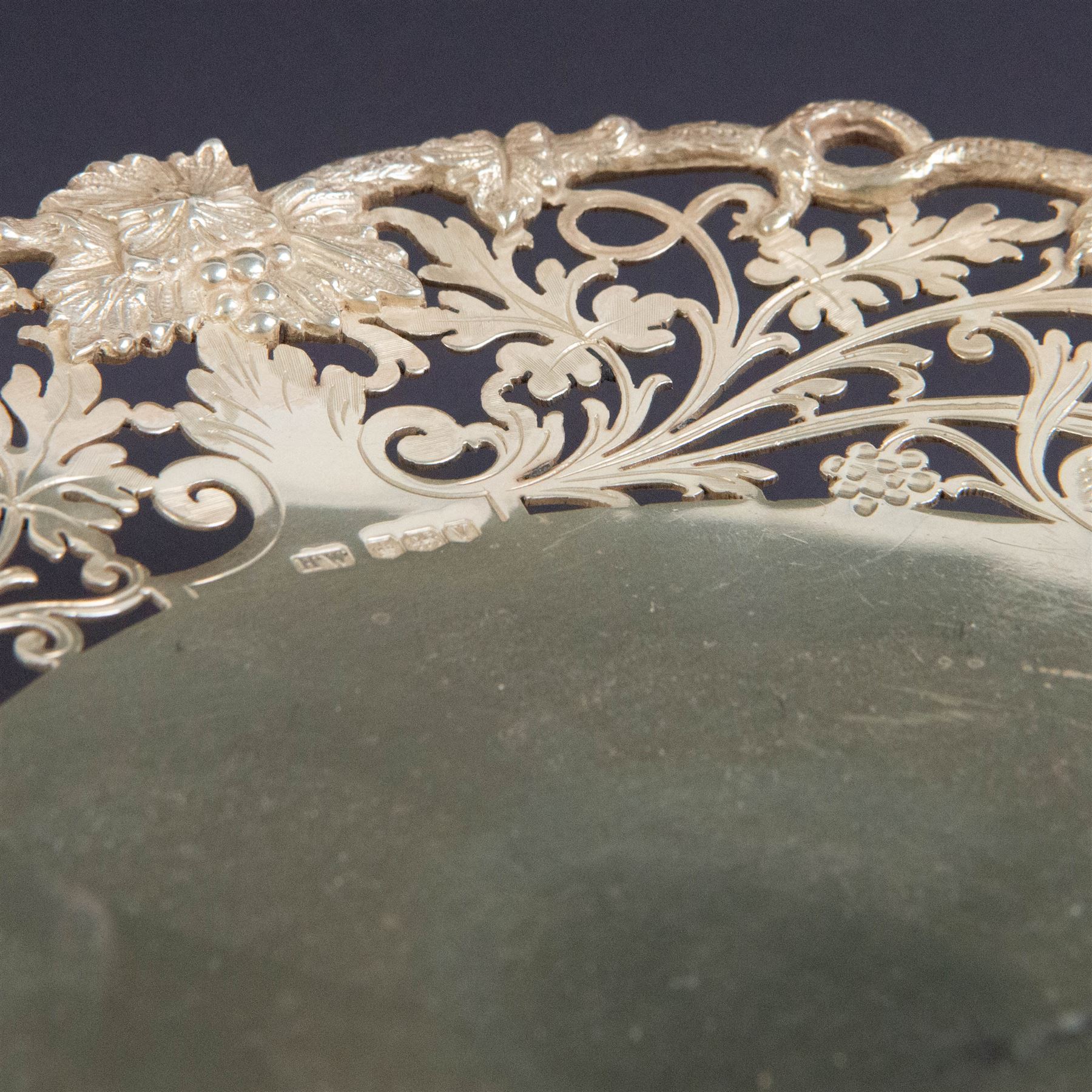 Pair of 1930s silver pedestal dishes, of circular form, the sides with pierced vine decoration, upon a domed pedestal foot, hallmarked Lee & Wigfull, Sheffield 1938, D21cm, H6cm