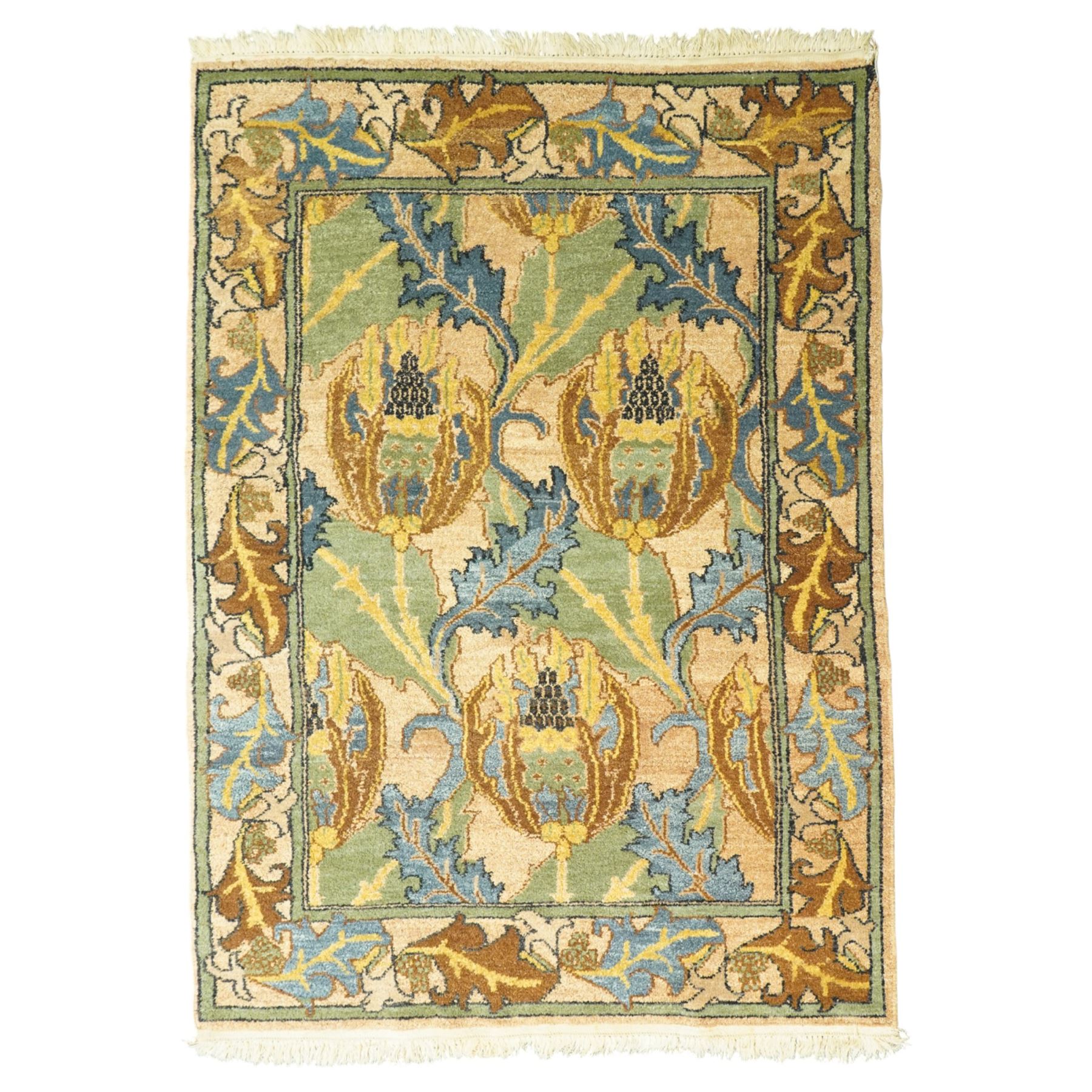 Arts & Crafts design wool pile rug, decorated with repeating stylized floral seed-head motifs and scrolling foliage within a complementary floral border in a muted palette of green, ochre, blue, and brown, with cotton fringe ends, with label for London House Oriental Rugs & Carpets  