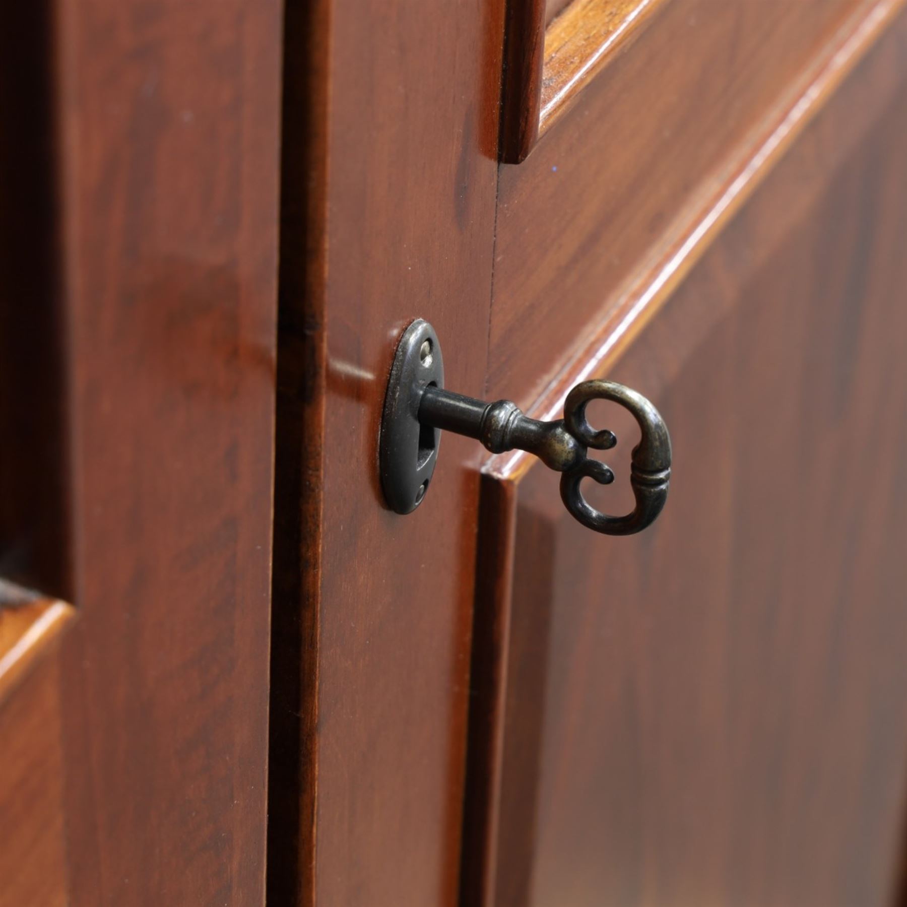 Willis & Gambier - mahogany bedroom wardrobe, projecting cornice with two additional rails, panelled doors with trouser rack and blue baize trinket, enclosing a shelf above a wooden clothes rail and shoe rack, raised on bracket feet 