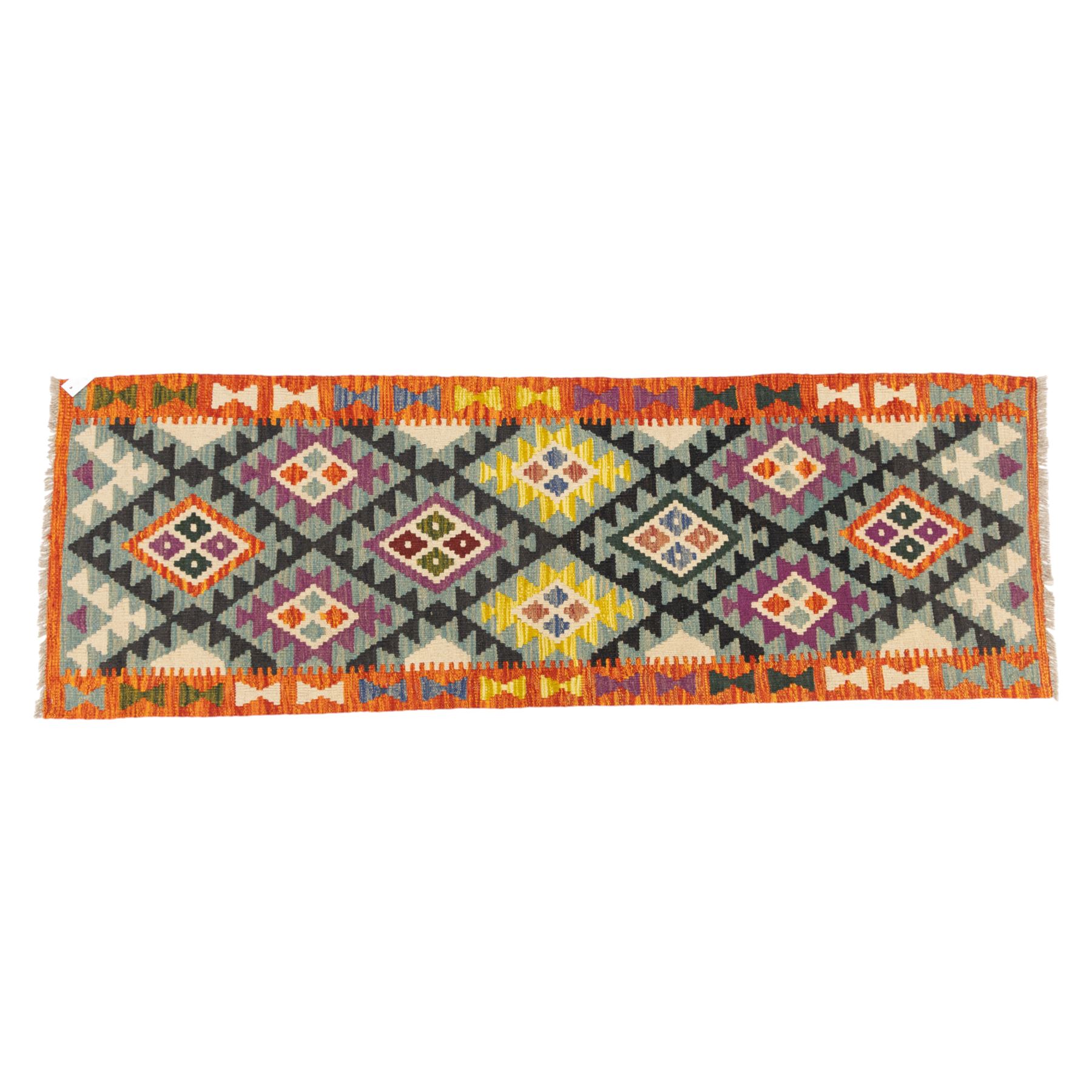 Chobi flatweave kilim runner with a repeating stepped diamond medallion design in live green, rust, teal, purple, and ivory, framed by chevron and geometric borders