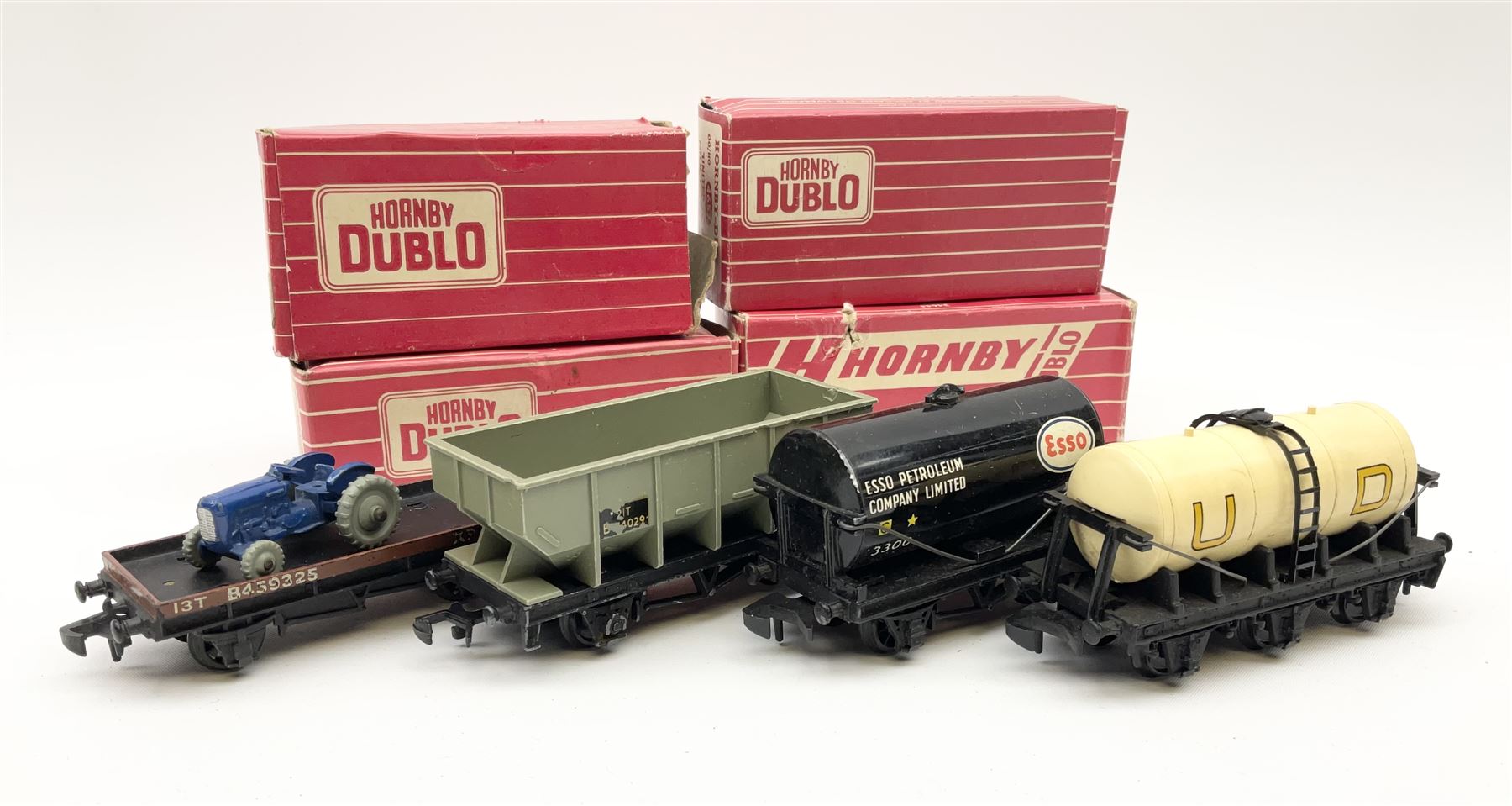 Hornby Dublo - 4644 21-Ton Hopper Wagon;4649 Low-Sided Wagon with tractor; 4680 Tank Wagon 'Esso' (Fuel Oil); and 4657 'United Dairies' Milk Tank Wagon; all boxed (4)