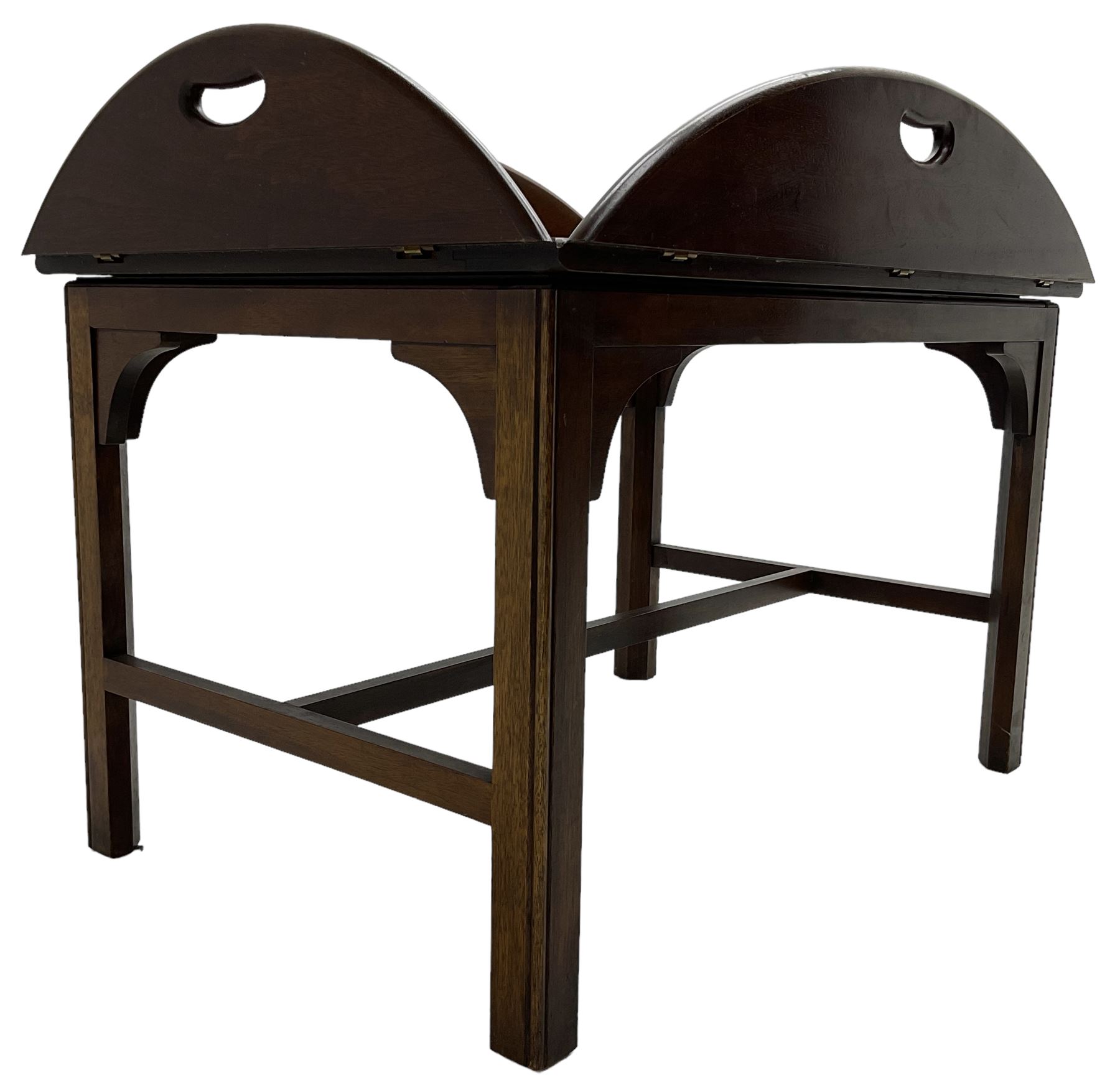 Mahogany butler's tray top coffee table, the removable tray with hinged sides and ends pierced with handles, on square moulded supports united by H stretcher 