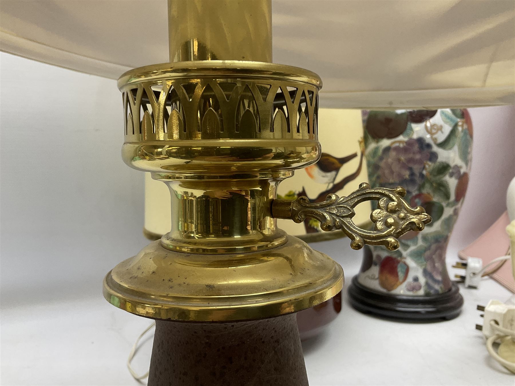 Collection of table lamps to include one of baluster form, decorated with fruit, one of squat, with a hand painted lampshade, and two standard lamps