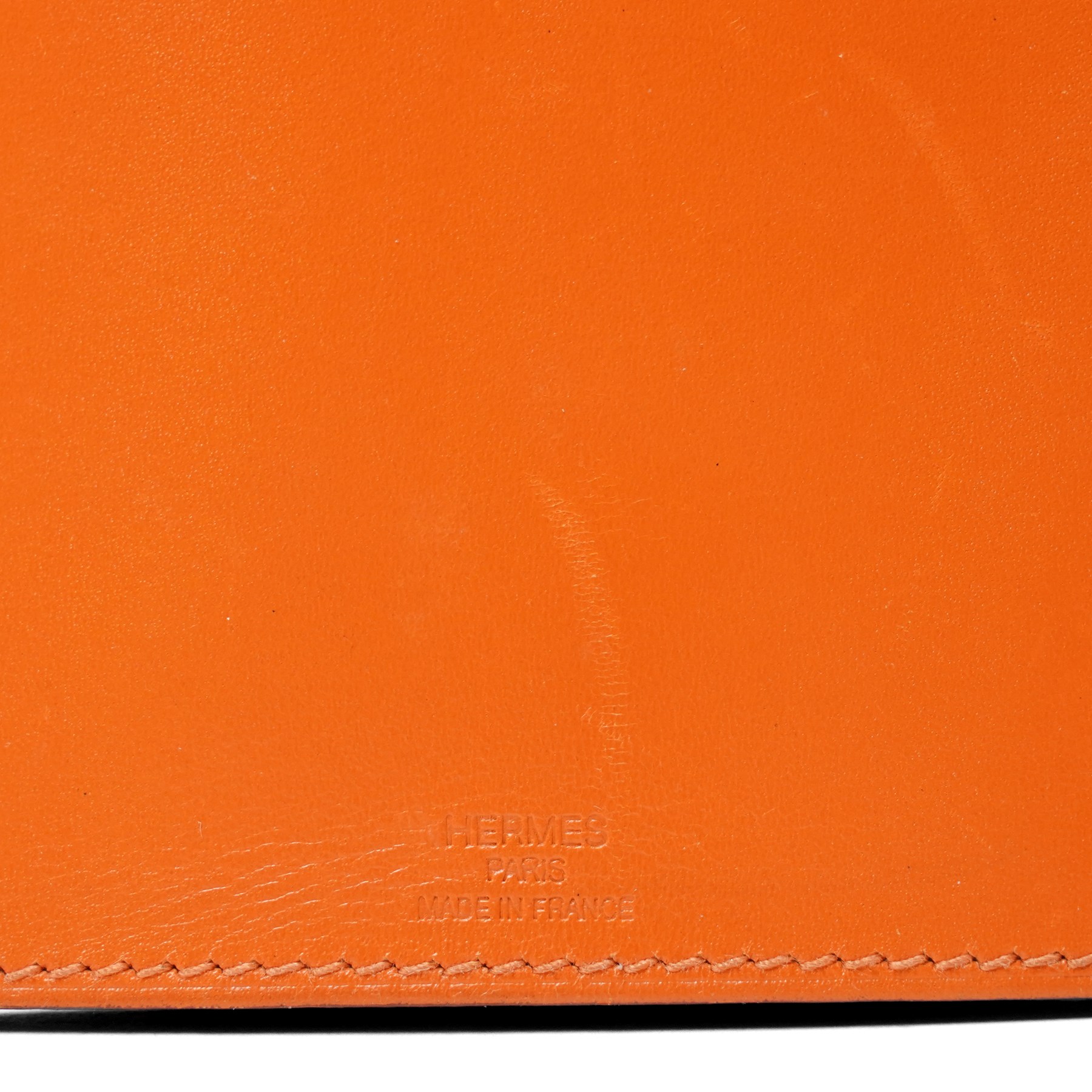 Hermès - ‘Press’ pocket torch, with orange leather sleeve