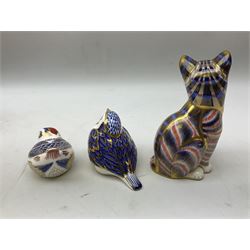 Three Royal Crown Derby paperweights, comprising seated cat and goldcrest both with gold stoppers, and robin with silver stopper, all with printed marks beneath, two with boxes, tallest H13cm