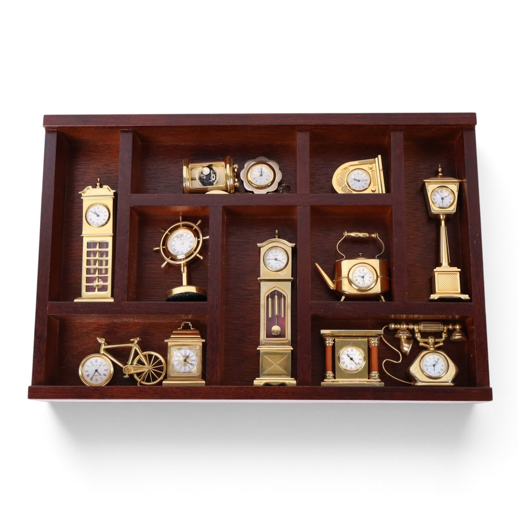 Large collection of miniature novelty clocks, including examples modelled as ships, a lamp, handbag, sewing machine, lamp etc 