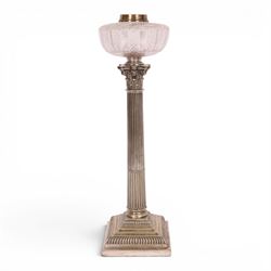 Victorian silver plated Corinthian column oil lamp, raised upon a stepped base, clear glas...