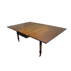 19th century mahogany gate leg dining table, rectangular drop-leaf top, raised on turned supports with brass castors