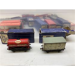 Hornby Dublo - twenty-four goods wagons including petrol tank wagons, open wagons, four-piece breakdown crane, mineral wagons, meat van, brake van etc, eleven boxed; two passenger coaches; and two Playcraft bogie wagons in boxes (28)