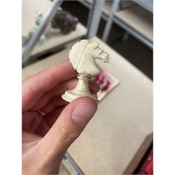 19th century walnut and brass bound games compendium box, painted to enhance the grain, of rectangular form, the hinged opening cover with rounded sides, central brass cartouche with engraved lion crest, and brass riveted straps, opening to reveal a red leather and blue silk lined compartmented interior, with fold-down games board, and lift-out tray containing playing cards, ebony turned dice towers, white and red stained bone draughts, and chess pieces, ivory dice, and ivory and ebony whist markers, and brass bezique board, cribbage board and markers, H15cm W32cm D24cm
This lot has been registered for sale under Section 10 of the APHA Ivory Act