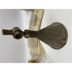 Brass and tin powder magazine by B.E. Chaplin of conical form with glazed see-through nozzle H27cm; eight reprinted gun case labels for Holland & Holland, Thomas Jackson & Son, William Ling, Watson & Hancock, Williams & Powell etc; and quantity of empty cartridge boxes and pellet tins