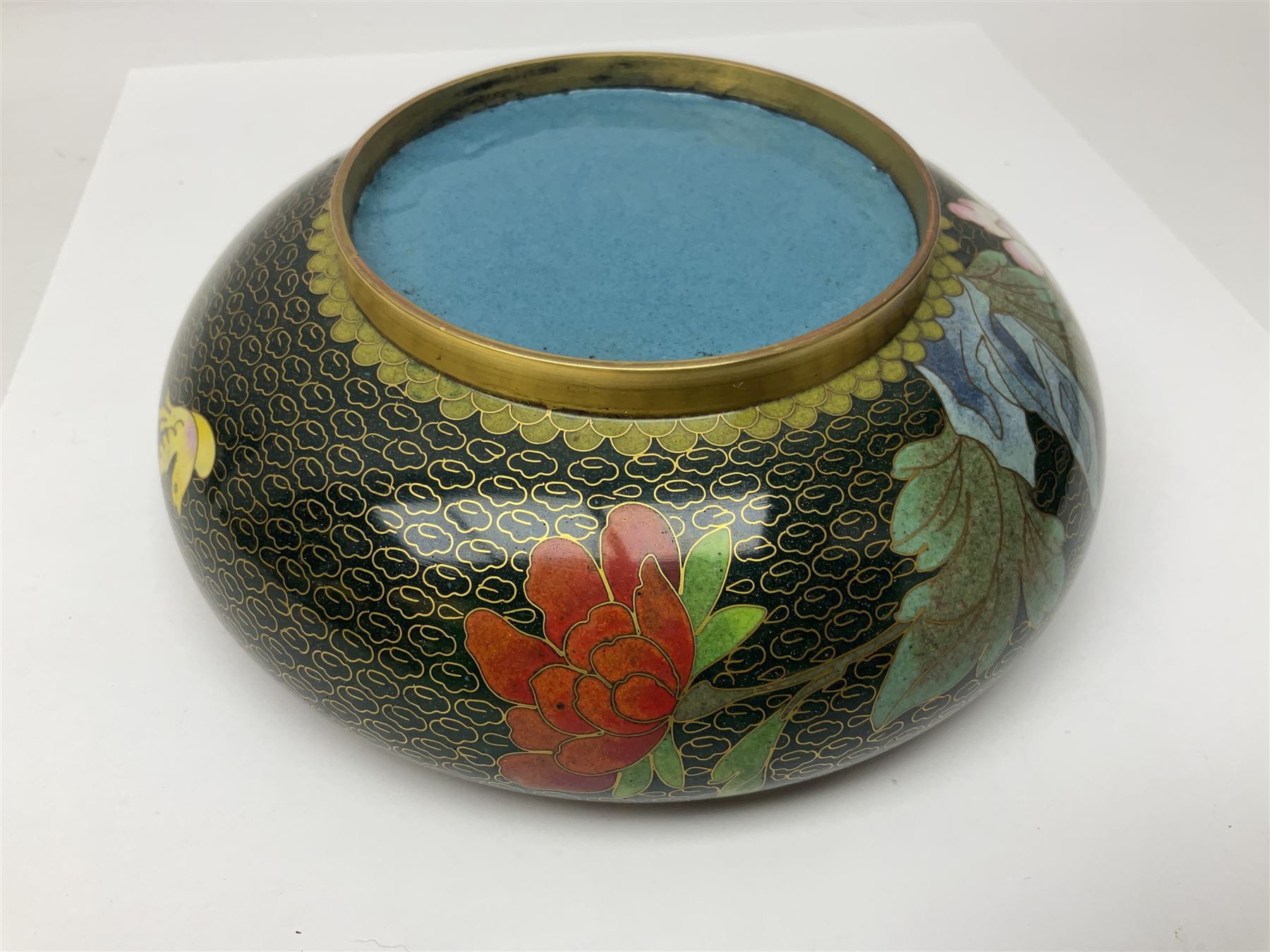 Pair of modern cloisonne ginger jars having floral decoration with a green ground, with hardwood stands, together with a similar plate and a bowl decorated with birds and flowers  