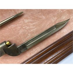 WW2 Lee Enfield No.4 Mk.1 .303 bolt-action rifle with hinged butt compartment, made by SA Ltd., Long Branch, Canada 1942, serial no.5L0646 L113cm; mounted on a framed display board with No.4 Mk.II spike bayonet, No.9 Mk.1 blade bayonet, two inert 5-round clips and brass biographical plaque by Antler Military Originals detailing DA Cert No.C3444 OLD STYLE DEACTIVATION SO FIREARMS CERTIFICATE REQUIRED OR RFD