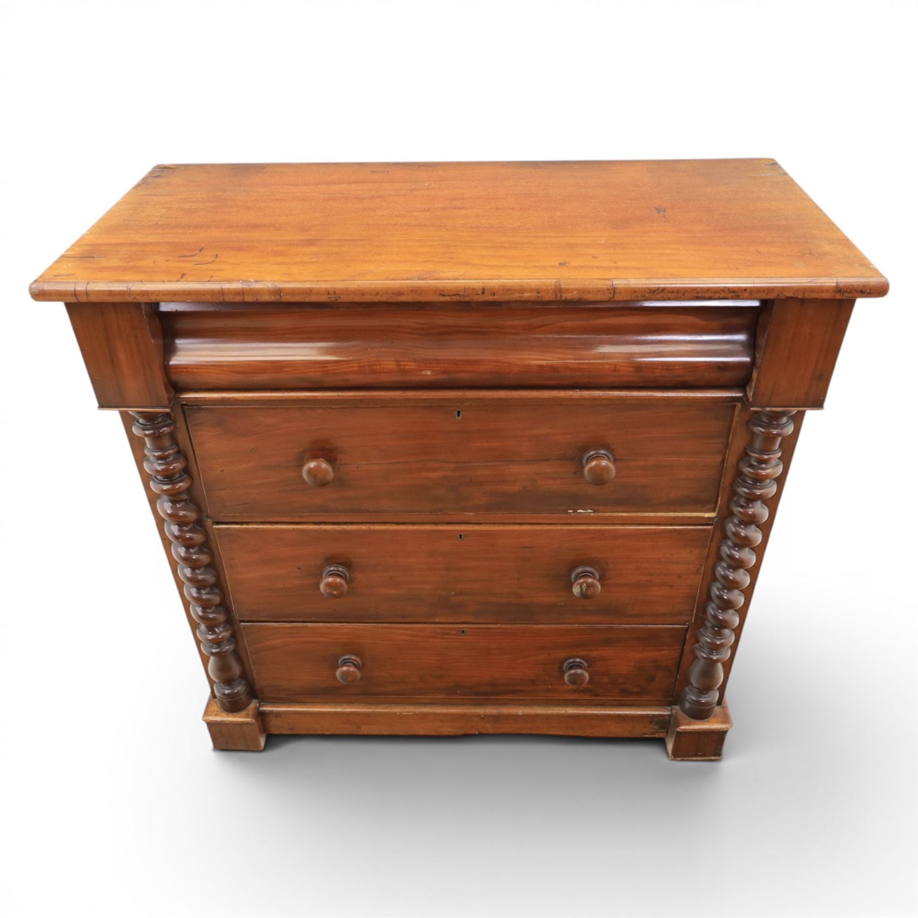 William IV style mahogany chest, rectangular moulded top over cushion-moulded frieze drawer and three long drawers with turned wooden handles, flanked by rope-twist turned pilasters, on plinth base