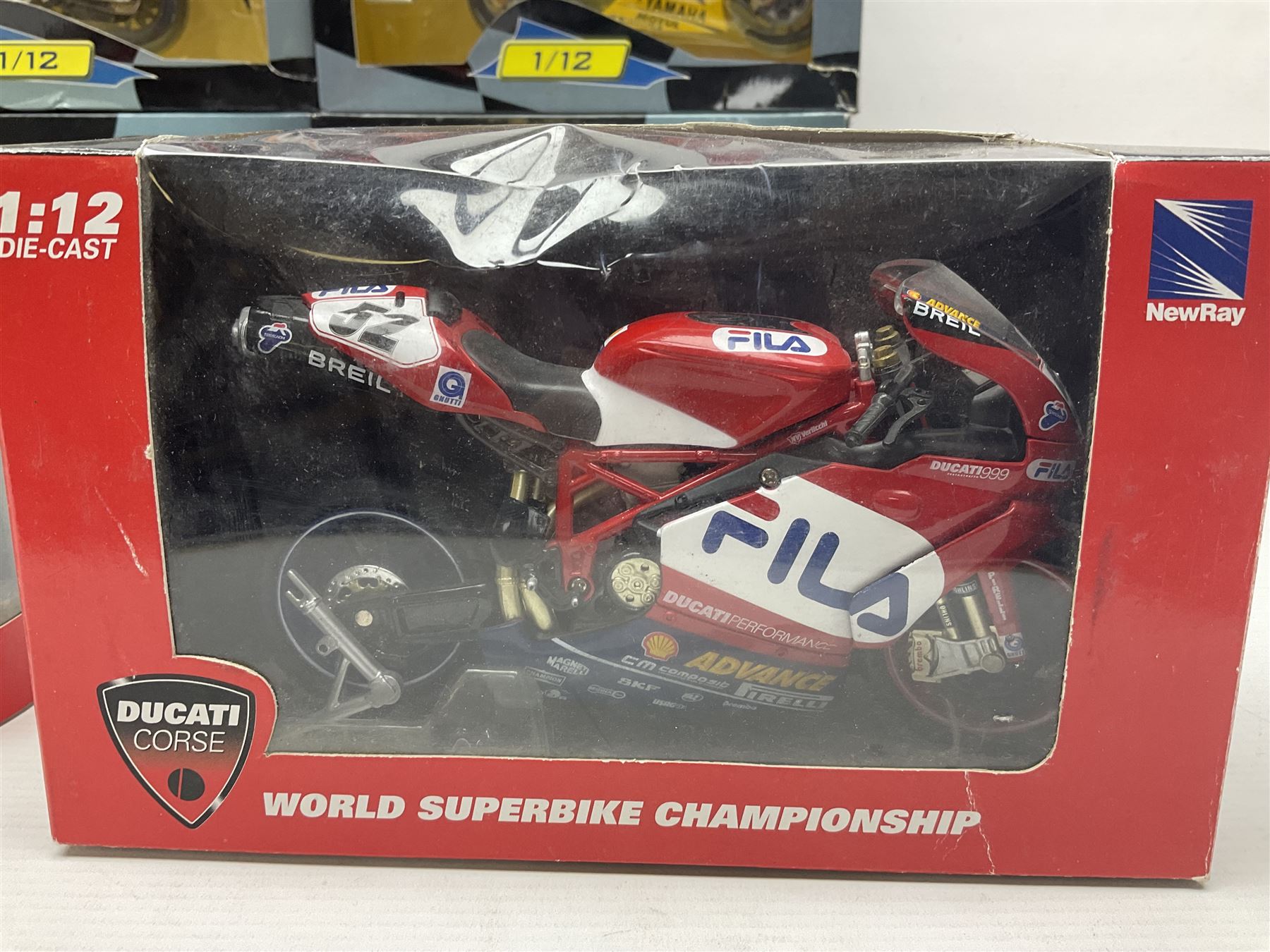 Nine NewRay 1:12 scale die-cast models of motorcycles including Ducati, Honda etc; and four other 1:12 scale die-cast models of motorcycles; all boxed (13)