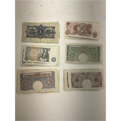 Bank of England Peppiatt ten shillings banknotes, four Peppiatt second period one pound notes 'T72H', 'K13H', R43E' and 'K89E', six Peppiatt fourth period one pound notes 'all with 'T21A' prefix, various Page one pound notes, The Royal Bank of Scotland one pound '16th July 1951' etc