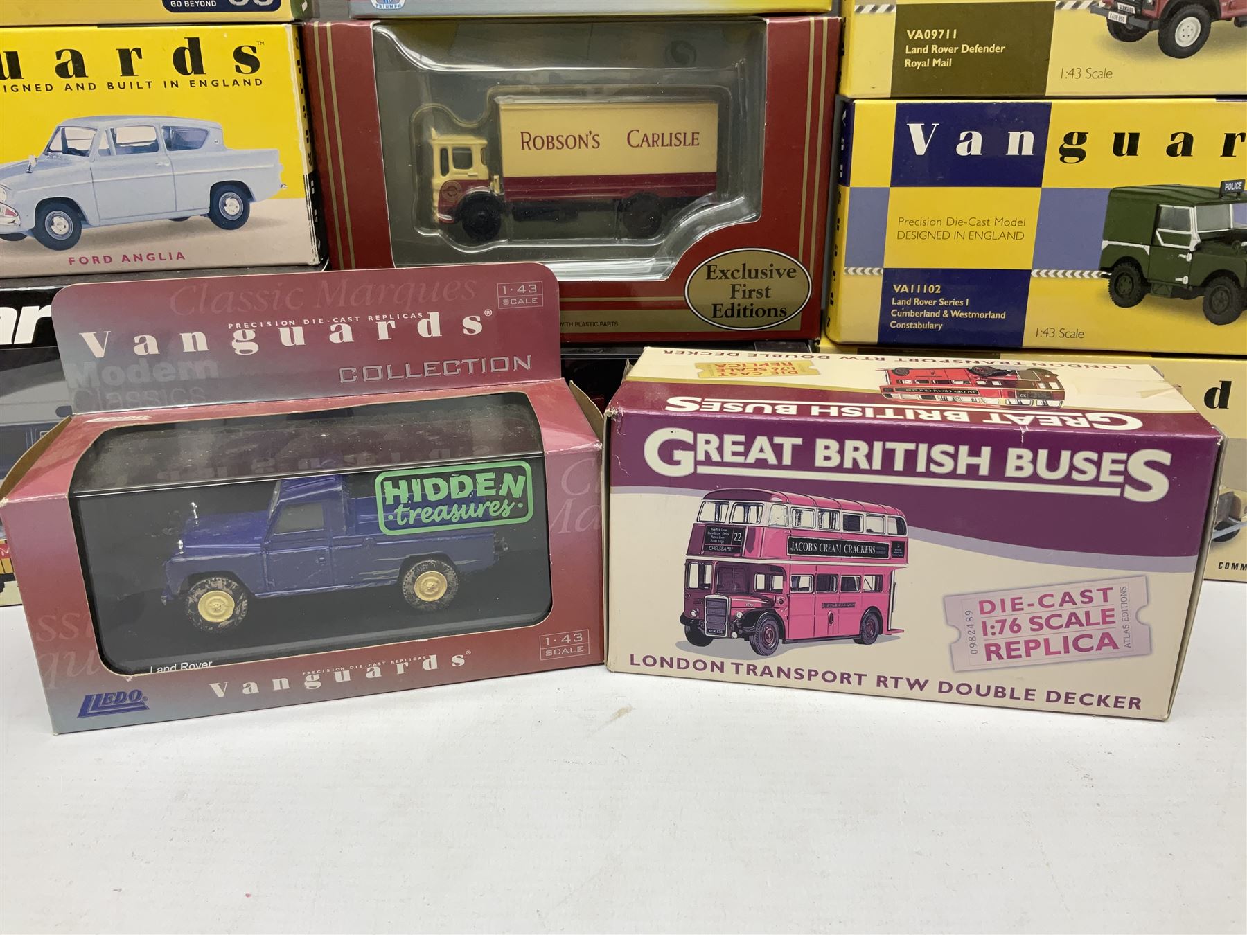 Eight Vanguards die-cast models by Corgi, Hornby and Lledo including Land Rovers, Ford Anglia and Triumph; together with thirteen other modern die-cast models by Bburago, Oxford, Atlas, EFE, Solido etc; all boxed; and small quantity of unboxed and playworn models
