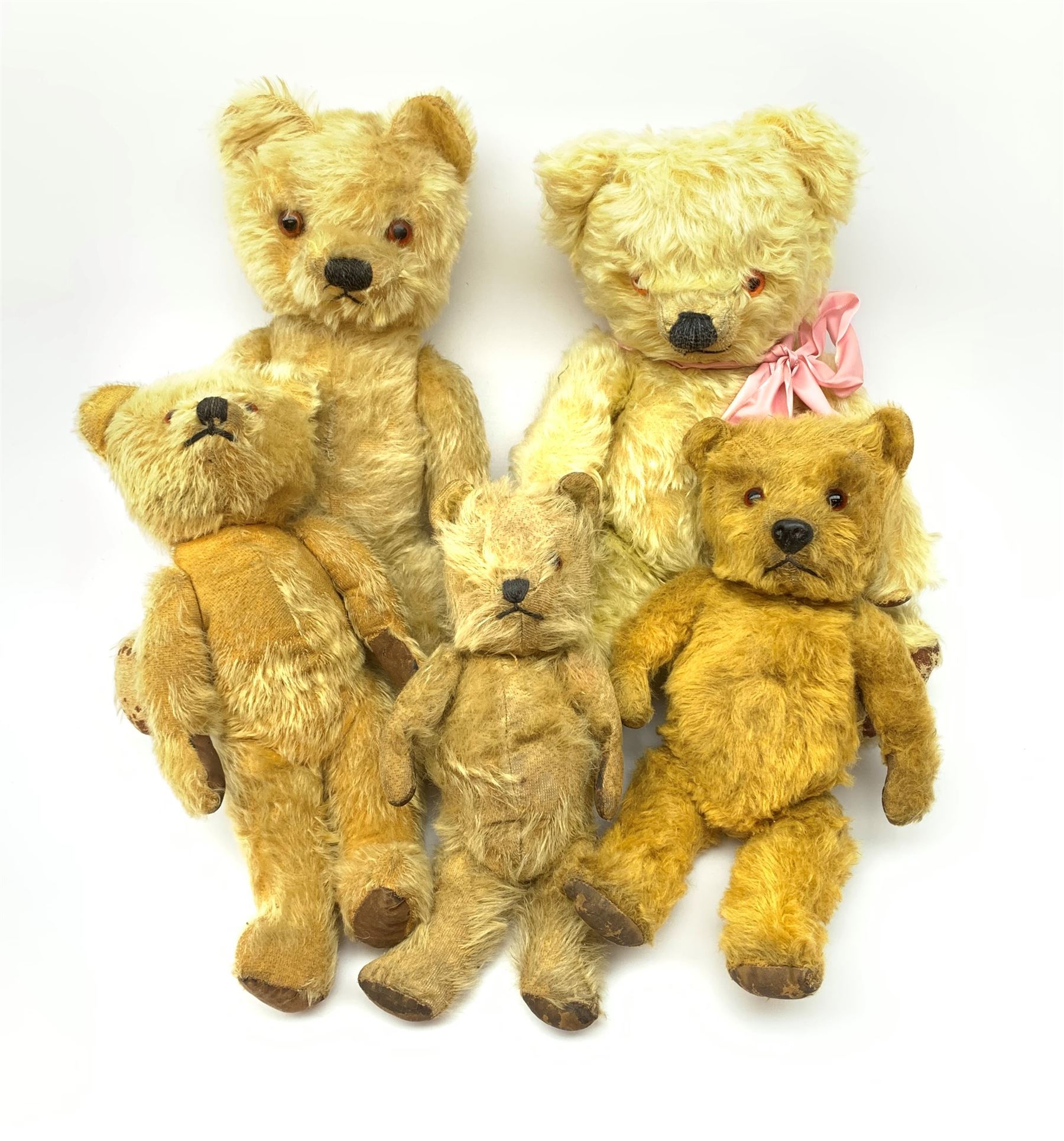 Five English teddy bears c1930s-50s comprising Chad Valley with swivel jointed head, glass eyes, vertically stitched nose and mouth and jointed limbs with rexine pads H16
