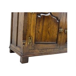 Early 20th century Jacobean design oak dresser sideboard, rectangular top with moulded edge over two baize-lined drawers with pierced handles, above two fielded panel cupboard doors, on stile supports