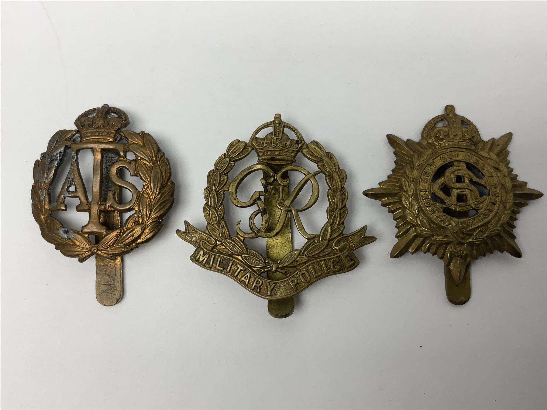 Twenty-seven military metal cap badges including Royal tank Corps, Reconnaissance Corps, Royal Armoured Corps, Royal Corps of Signals, Womens Army Auxiliary Corps, Queen Mary's Army Auxiliary Corps, Auxiliary Territorial Service,  Royal Engineers, REME, Army physical Training Corps etc 