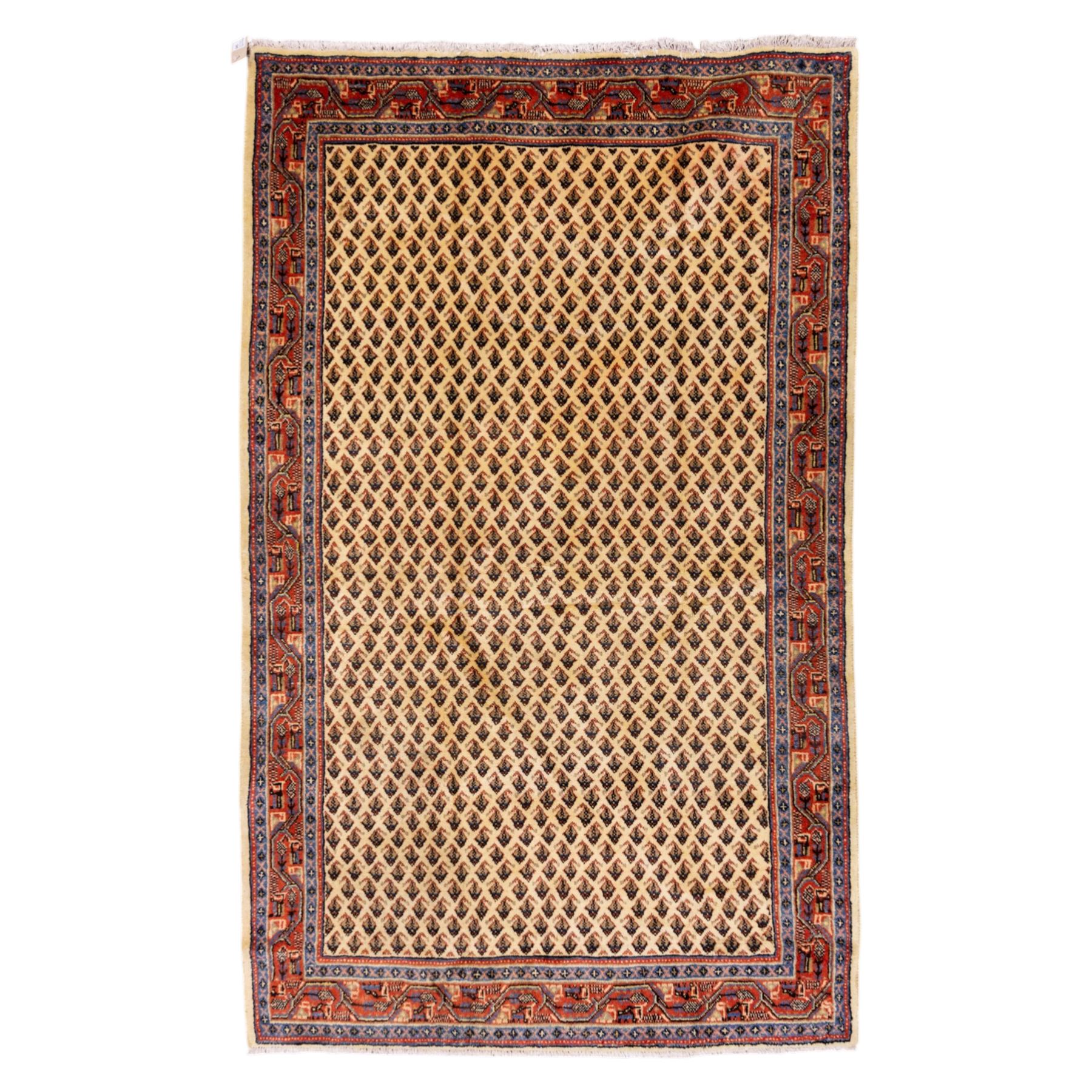 West Persian Boteh-Mir hand-knotted rug, ivory field densely decorated with a repeating lattice of of small boteh motifs arranged in diagonal rows enclosed by a broad border of stylized geometric devices and angular floral ornament between multiple guard stripes with cotton fringe ends 