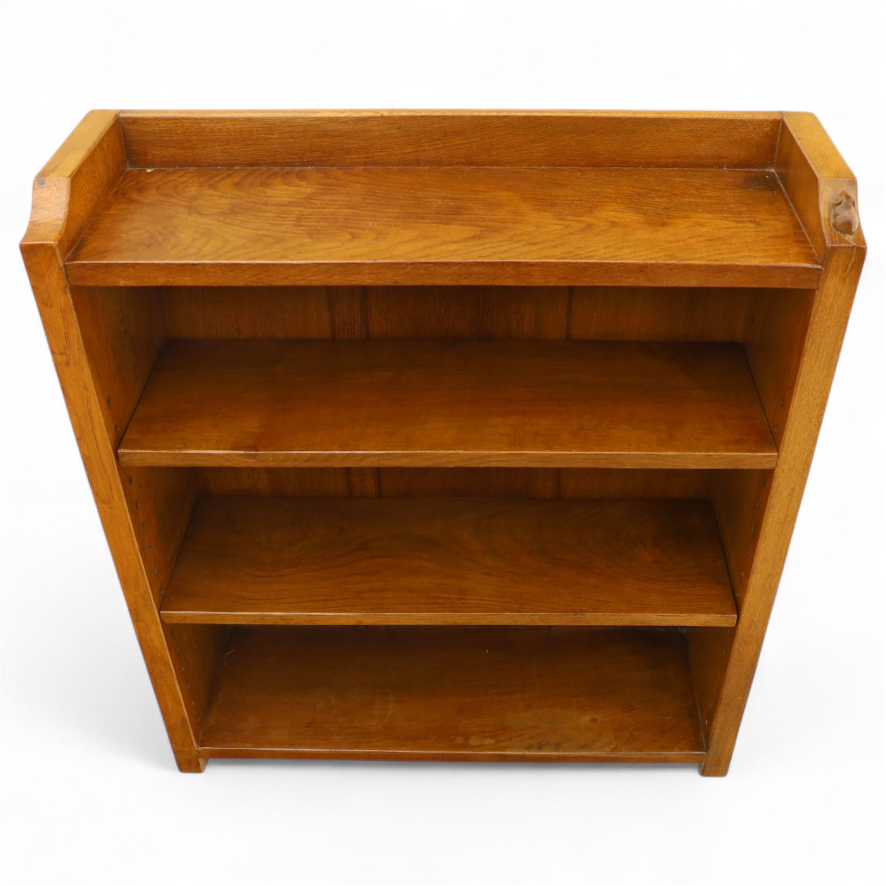 Mouseman - oak open bookcase, galleried top with the signature mouse motif carving, two adjustable shelves, by the workshop of Robert Thompson, Kilburn