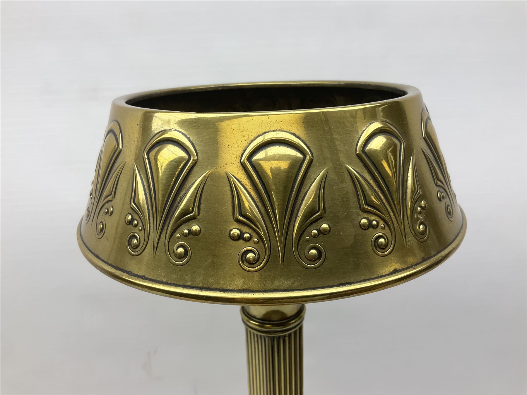 Early 20th century Daalderop of Holland Art Nouveau brass smokers stand, the square sided column stem raised upon circular spreading base with mounted ash tray decorated with typical Art Nouveau stylised motifs, with mark beneath, H72cm