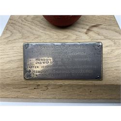 Raich Carter - early school cricket trophy of a cricket ball mounted on an oak base with white metal plaque inscribed 'Swan Cup Final/July 1927/Hendon v Jas.Wms.St/Scores/Hendon 189 for 2 wickets/Jas.Wms.St 55/Carter 111 runs (not out) Four wickets for 21 runs/Hendon School Souvenir/from his Head master G.F. Park' L20cm. Provenance: By direct descent from the family of Raich Carter having been consigned by his daughter Jane Carter.