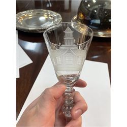 Dutch engraved Newcastle light baluster glass, circa 1760, the funnel bowl engraved with a two storey country house and church flanked by trees, beneath the inscription ‘T WELVAREN VAN LANDT ENKERK’ (The prosperity of the Country and Church), upon a multi knopped stem with beaded knop and basal knop, over conical foot, H18cm



