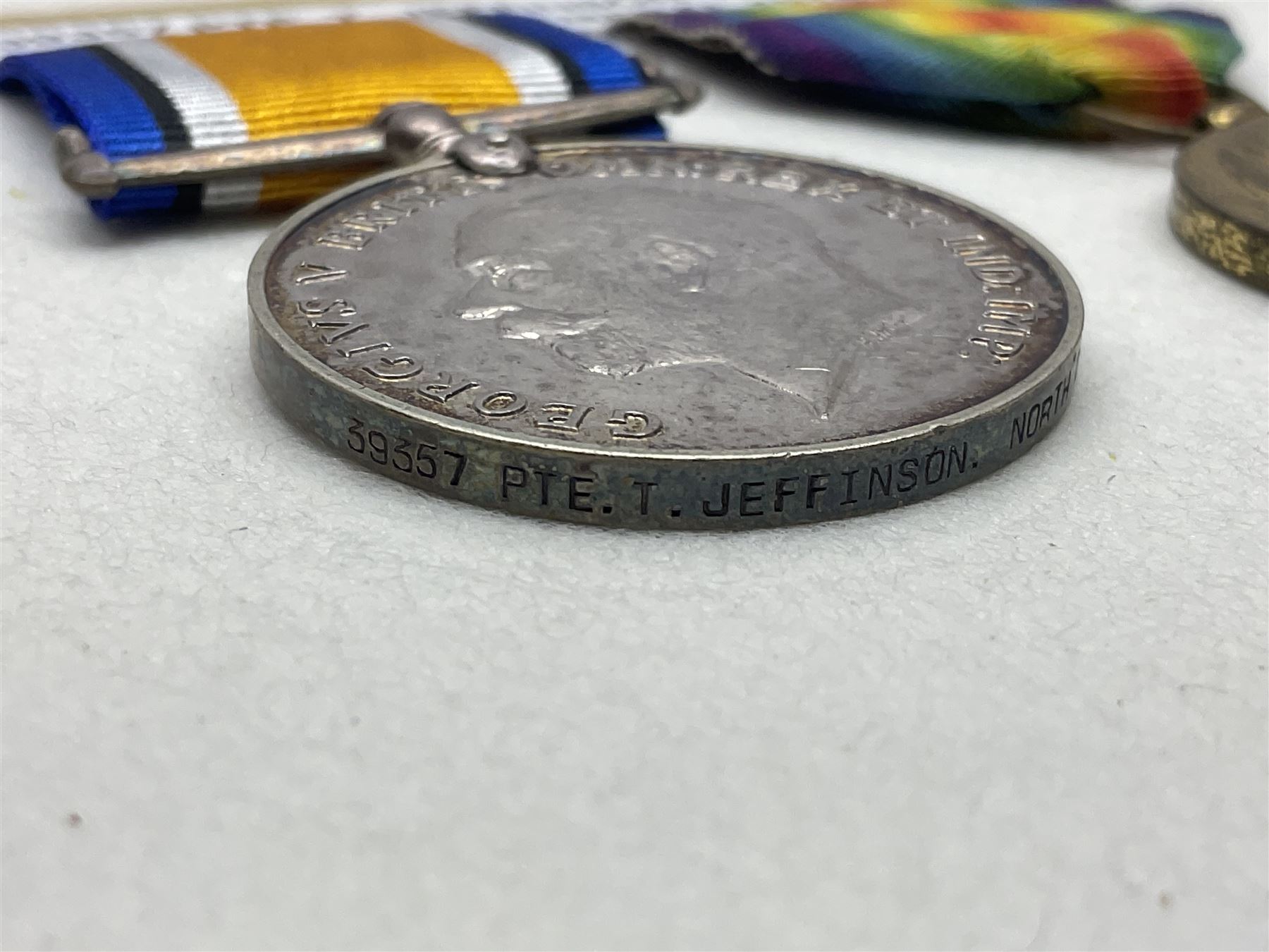 WWI pair of medals comprising British War Medal and Victory Medal awarded to 39357 Pte. T. Jeffinson Northumberland Fusiliers; both with ribbons (2)